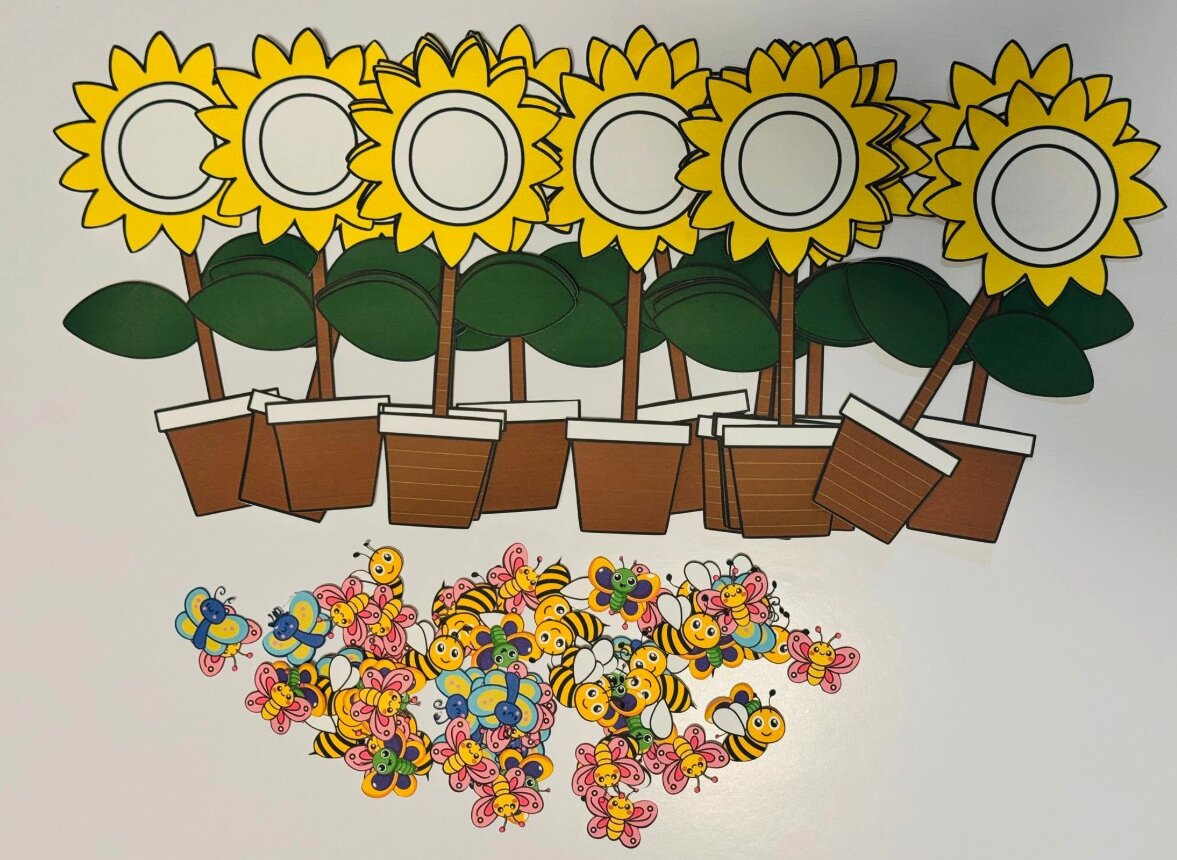 Cut-out sunflower templates with bees and butterflies
